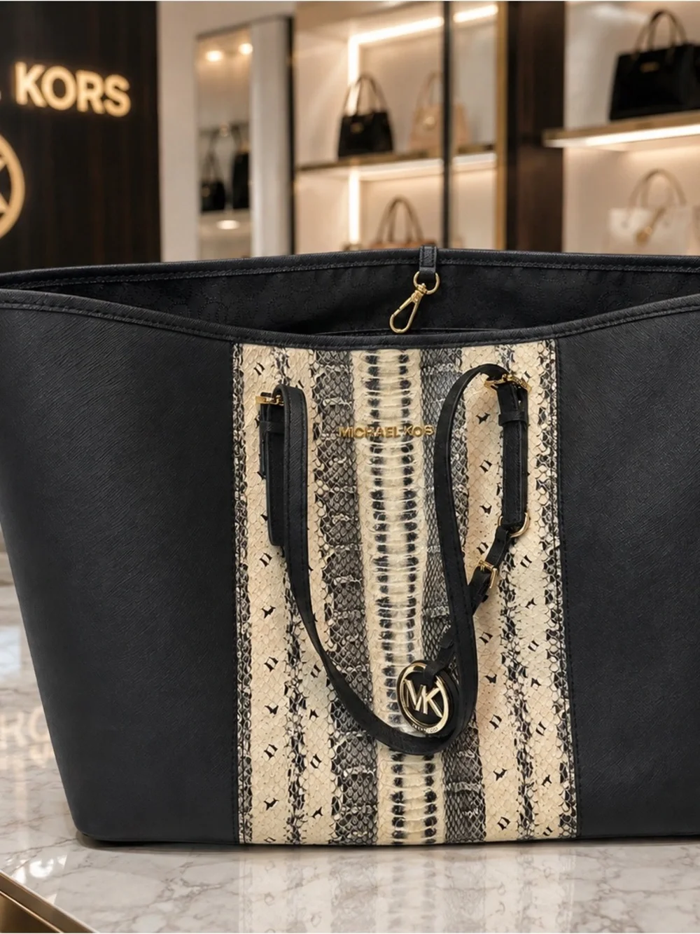 Michael Kors Saffiano leather paired in anaconda or python-print center